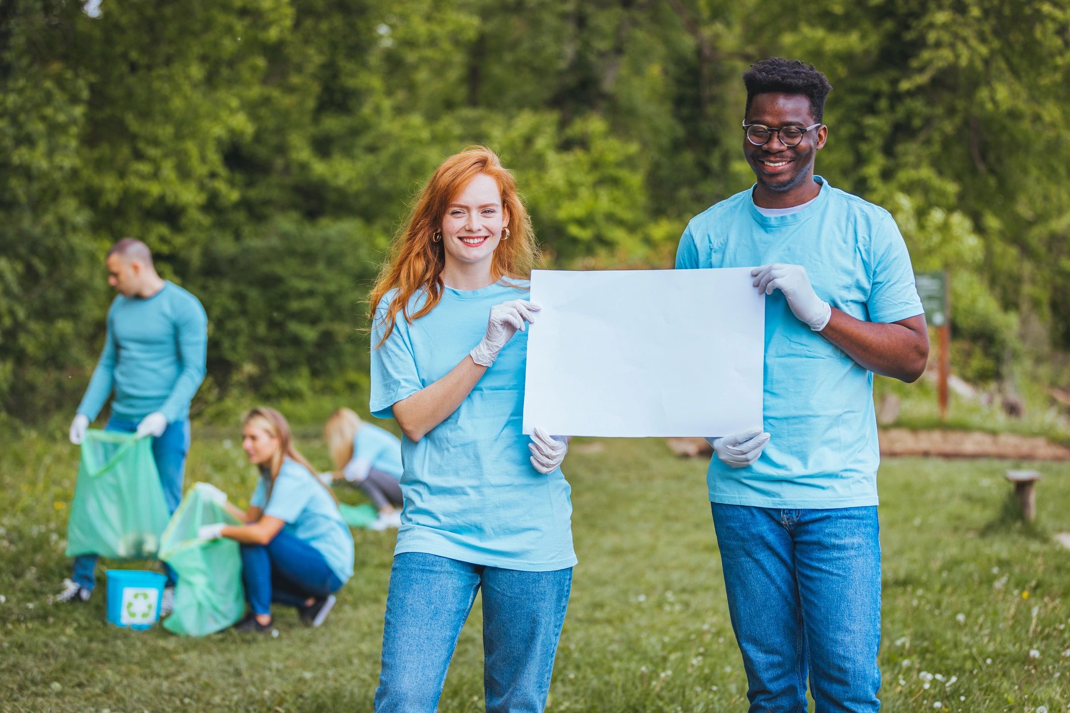 Young volunteers supporting a community clean-up