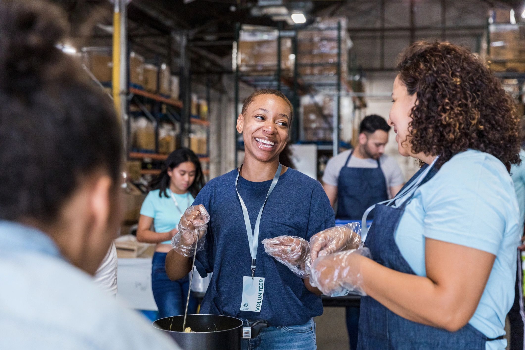 Volunteers serving at a community food drive